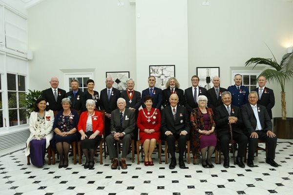 Diane Nutsford, as she received a Queens Service Medal at Government House with group.