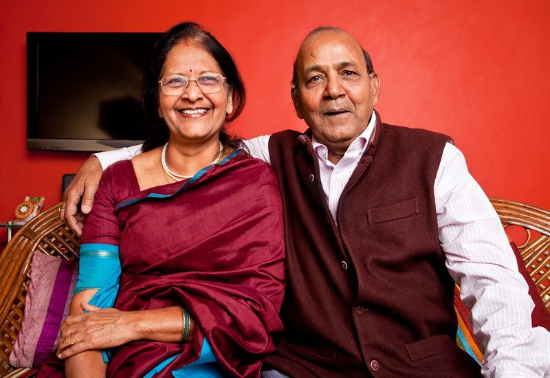 A couple sitting together smiling