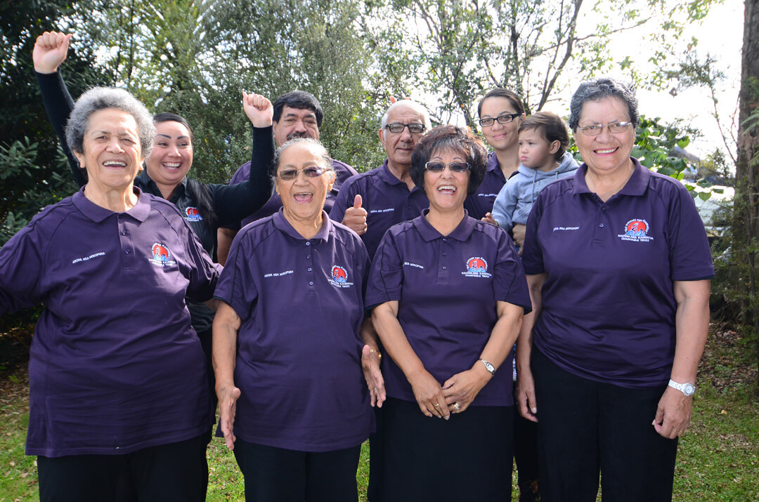 A group of people form the Rauawaawa Kaumātua Charitable Trust smiling