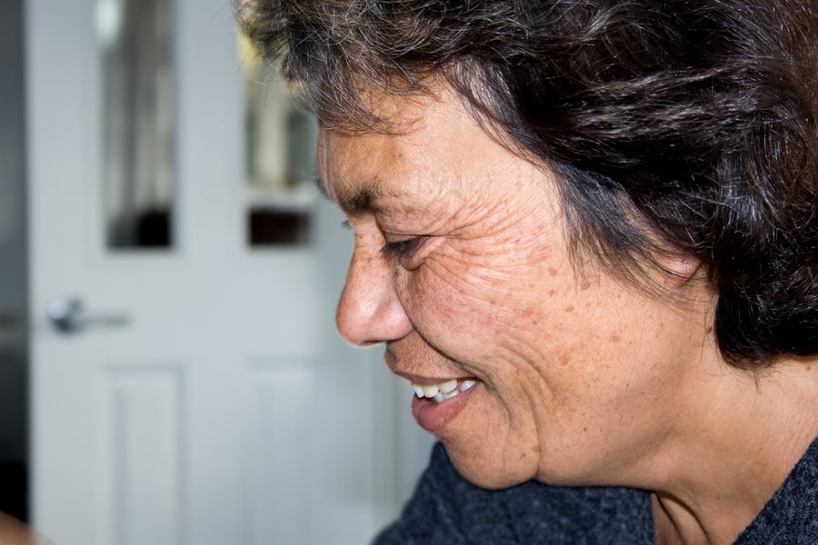 Side portrait of a woman smiling