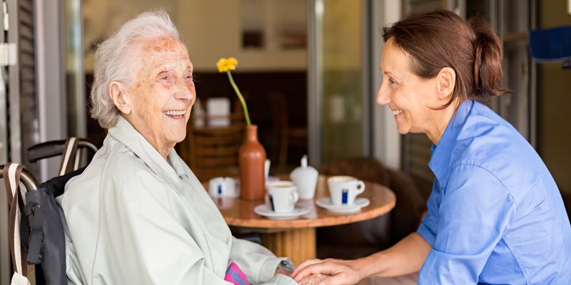 Two women laughing together