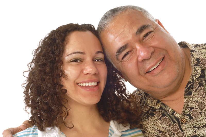 Father and daughter smiling together