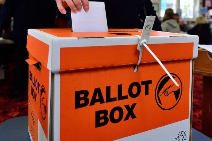 Placing a vote in a ballot box