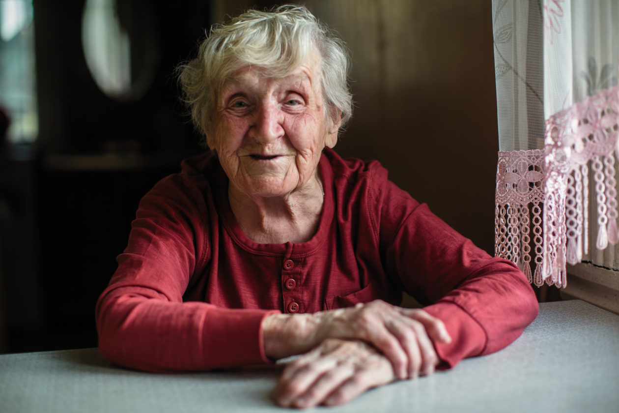 Older lady sitting at table