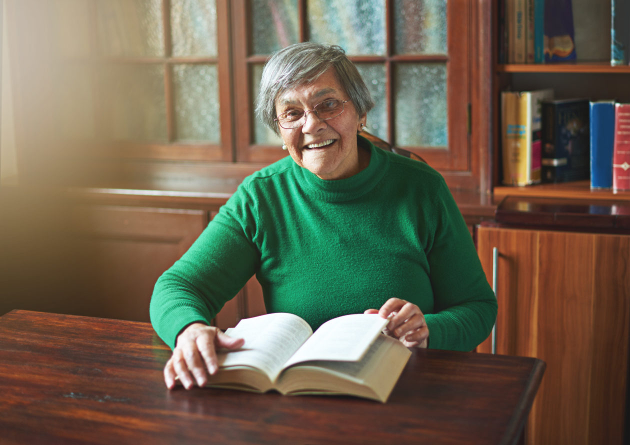 Older woman reading book