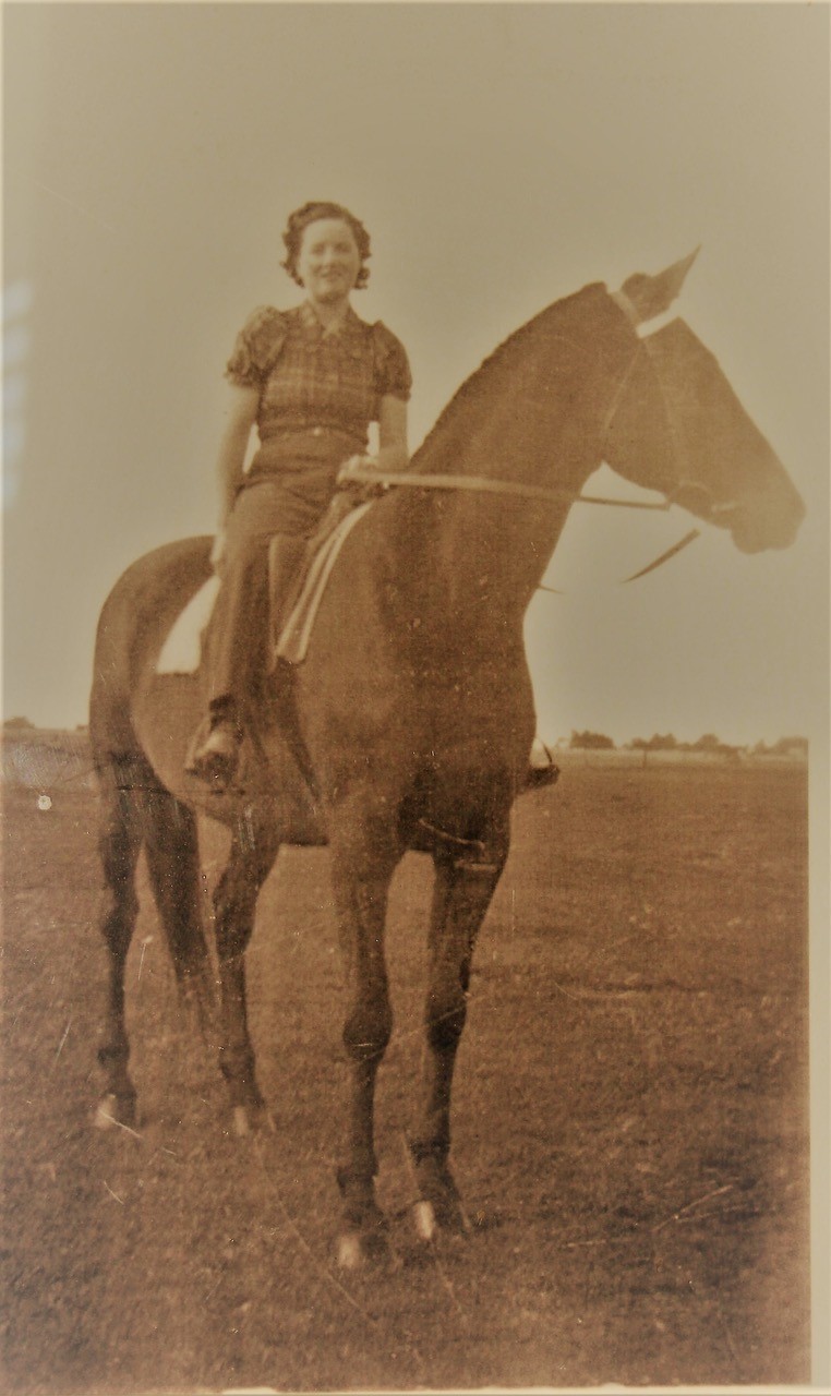 Old black and white photo of young Margaret Christiana on a horse