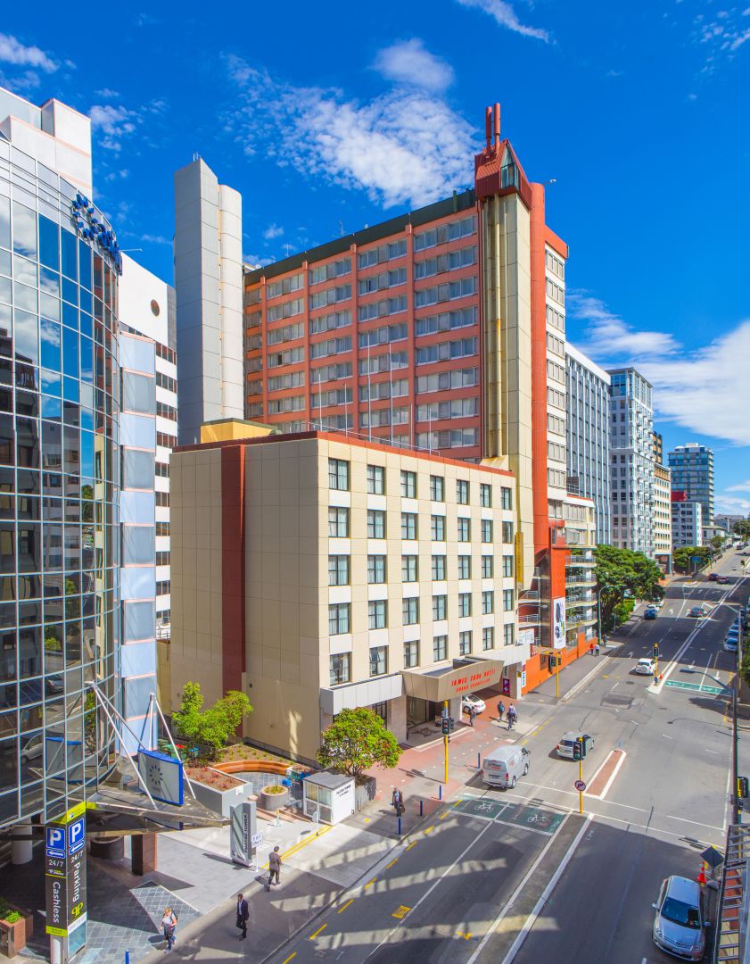 Exterior of hotel on sunny street