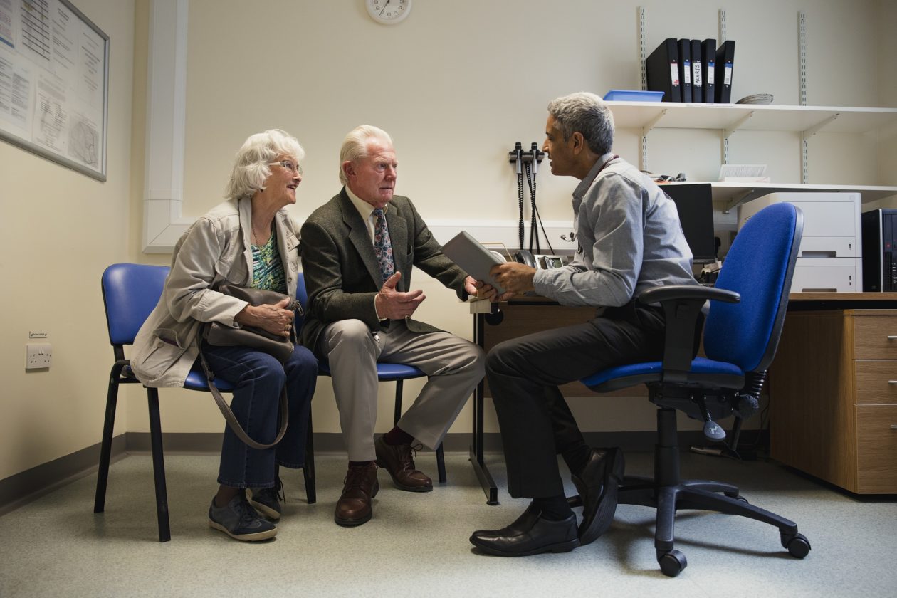 Couple speaking with a doctor