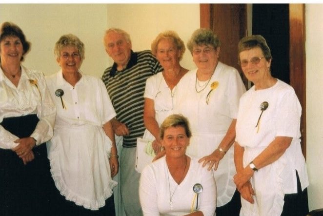 An old photo of Helen and Maxine with the fundraising team at Alzheimers Whanganui 