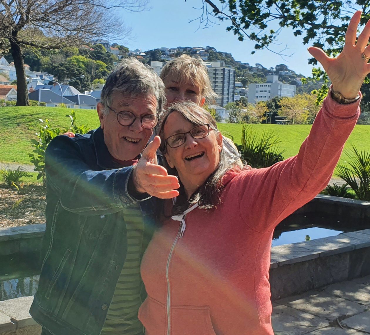 Three people from the Younger Onset Dementia Aotearoa Trust walking in the park